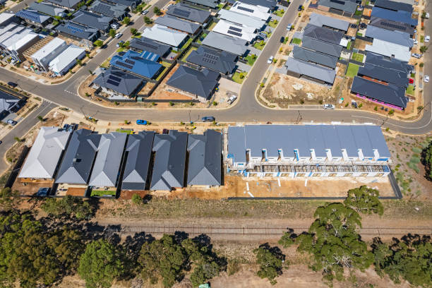 istock Aerial view urban sprawl with new housing development and railway line 1466640839