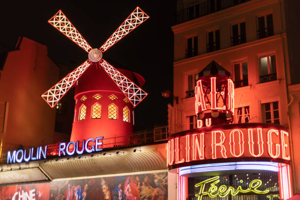 moulin rouge in paris illuminated at night in winter
