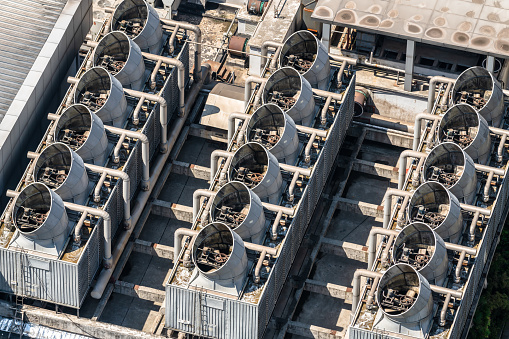 A large group of air conditioners on the rooftop