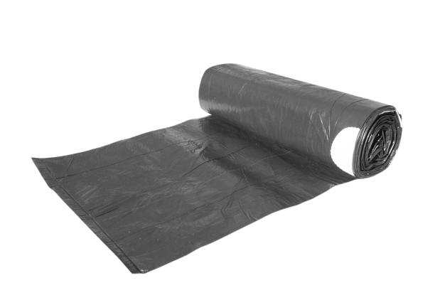 istock Black recycle rolls of garbage bin bags isolated on white background with copy space. Roll of garbage bags close-up 1466643983