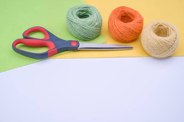 istock decoration yarn felt sheet and scissors on a bright wooden background 1466644523
