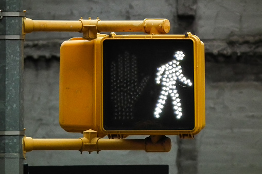 Close Up Macro Photograph of Go Walking Traffic Light Sign in downtown New York City, USA