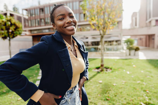 istock Stylish african female student near university campus. 1466646174