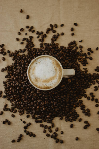 istock Cup of coffee latte on roasted coffee beans 1466646921