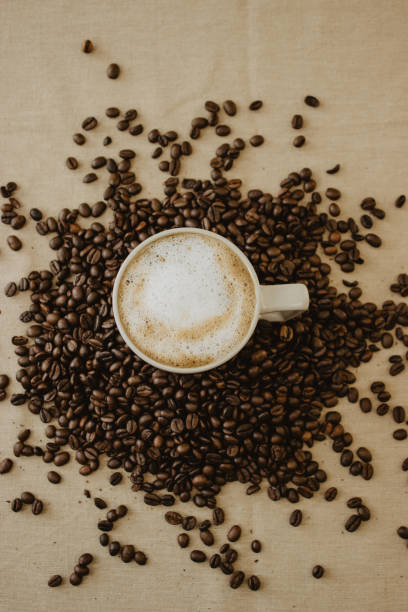 istock Cup of coffee latte on roasted coffee beans 1466646923
