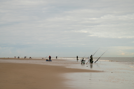 A Fishing off New Brighton beach the Wirral in UK