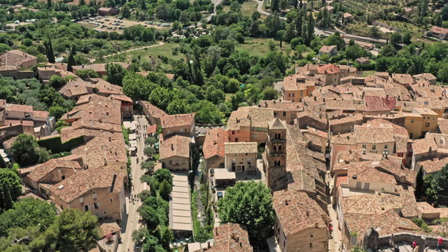 Moustiers Sainte Marie France Aerial v3 cinematic shot drone low level fly through rocky limestone canyon reveals breathtaking middle ages architectures and village townscape - July 2021