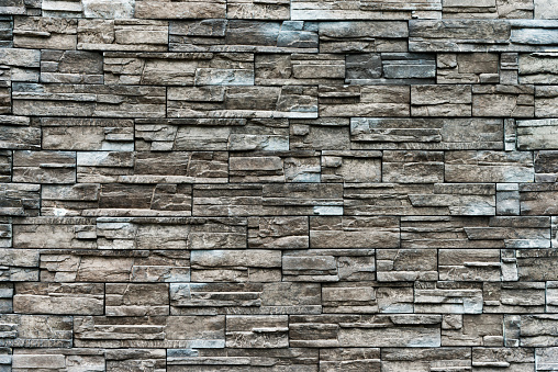 Backgrounds of brown stone wall.