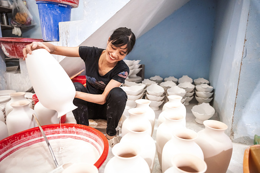 view on woman working in vietnamese ceramic manufacture