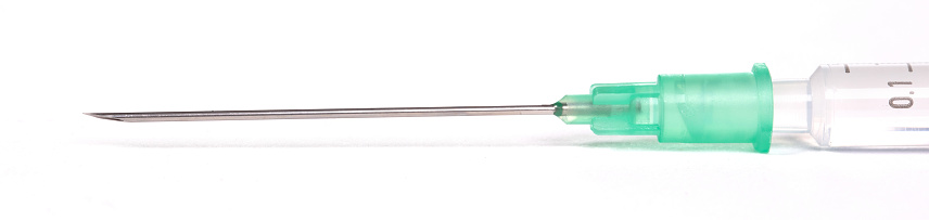 Syringe injection or medical needle isolated on white, selective focus