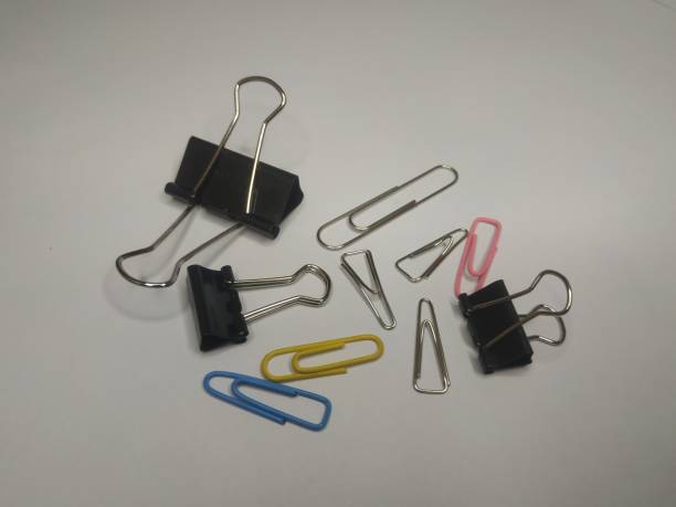 istock office stationery. Paper clips, binder clips, trigonal clips 1466660320