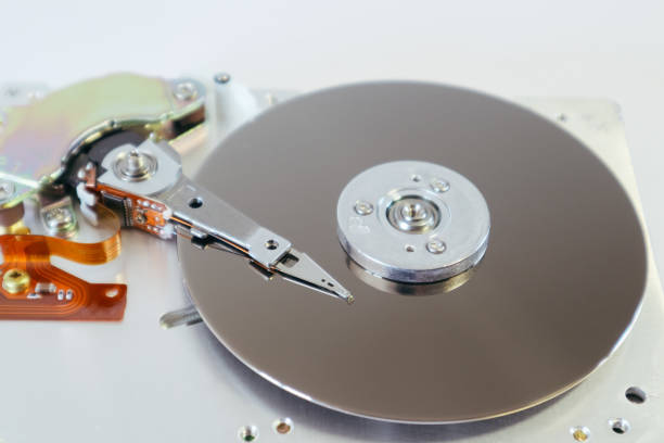 istock Disassembled computer hard drive. Data hard drive backup disc hdd disk restoration. Hdd with mirror effect. 1466667549