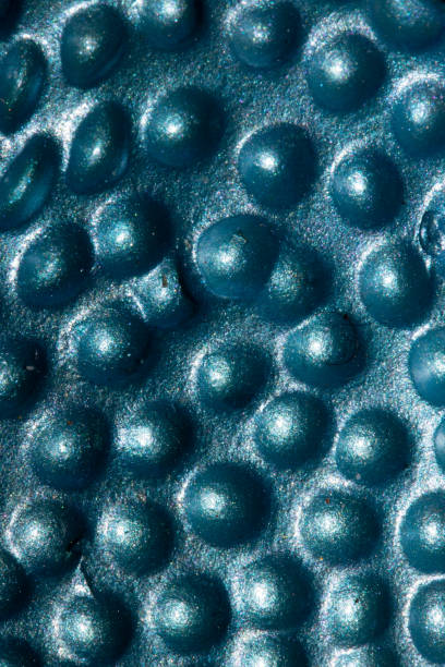 istock Alien trypophobia holes in a shiny sci-fi close up background 1466668946
