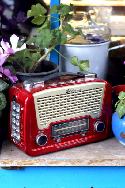 istock Red retro fm radio on the blue window 1466672176
