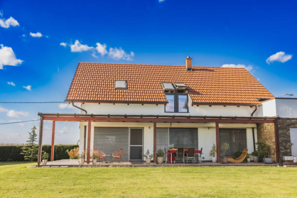 istock House with terrace and large garden in front,view from low angle 1466672189