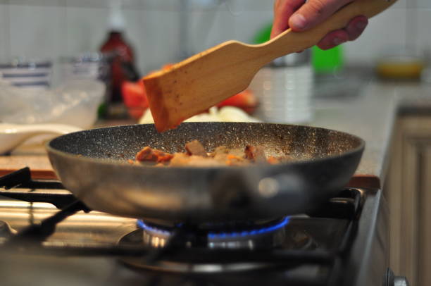 istock a man is cooking stew in the kitchen 1466672283