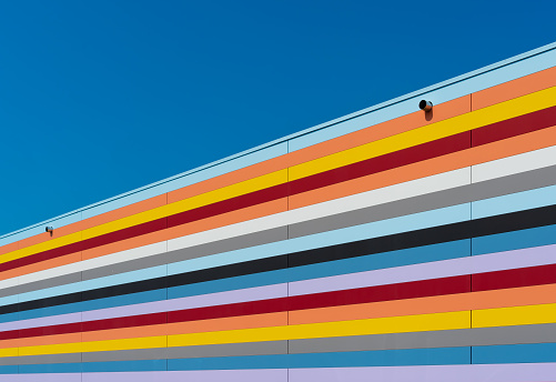 Multi colored building against clear blue sky