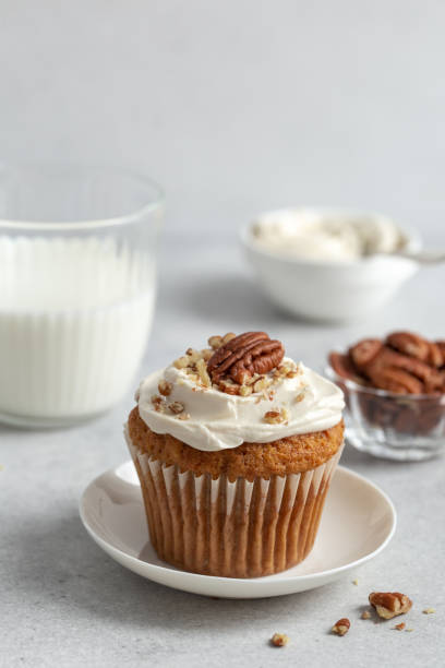 istock carrot and nuts cupcake with cream cheese frosting 1466672418