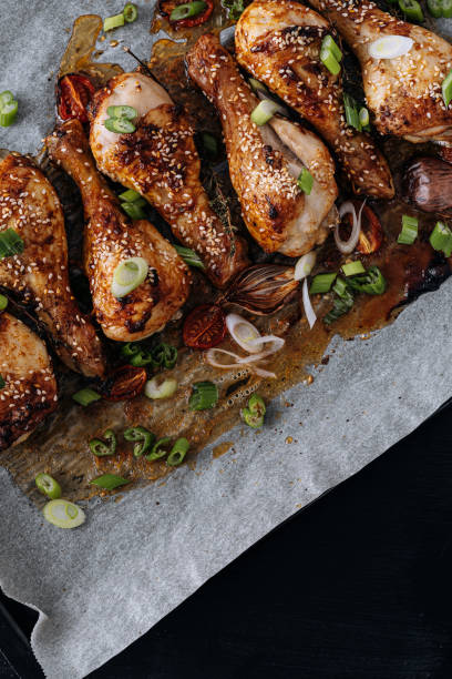 chicken drumsticks with sesame stock photo
