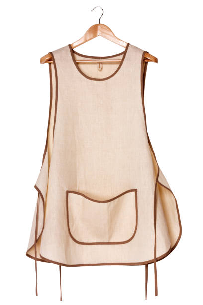istock Kitchen linen eco-friendly women's apron on a wooden hanger. Front view. Isolated on white background 1466672634