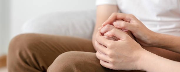 istock Couple hold hand support each while discussing family issues with psychiatrist. Husband encourages and empathy wife suffers depression. psychological, save divorce, Hand in hand together, trust, care 1466675225