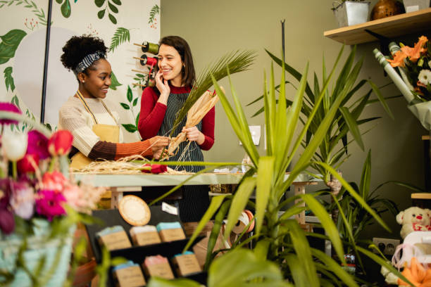 istock Flower shop employees work at their small business 1466676478