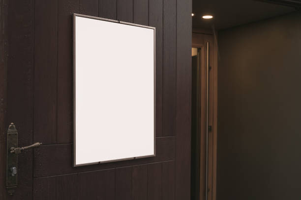 istock Empty menu board fixed vertically on wooden door of street cafe 1466677249