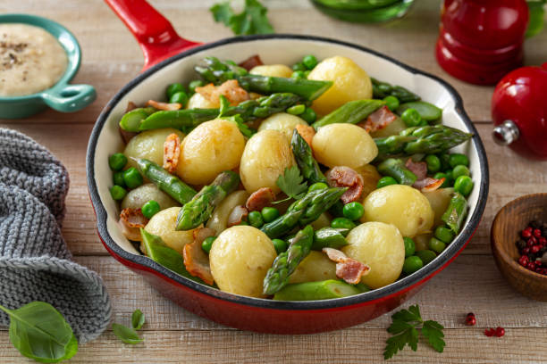 istock Roasted baby potatoes with asparagus, bacon and peas 1466685417