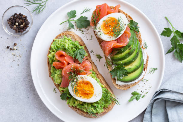 istock toasts with avocado, smoked salmon and egg 1466686837
