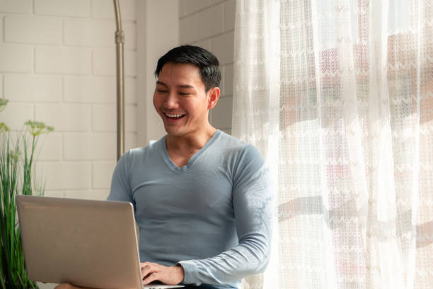 istock LGBT Young men use computers to communicate with their peers. on the days at home cannot go out. 1466688594