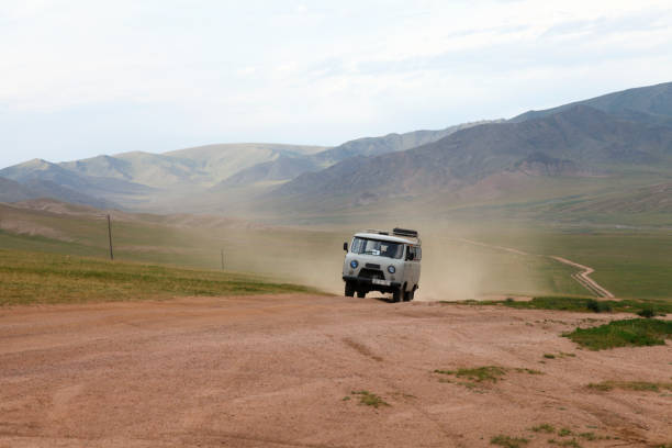 istock Van moving on dirt road 1466694240