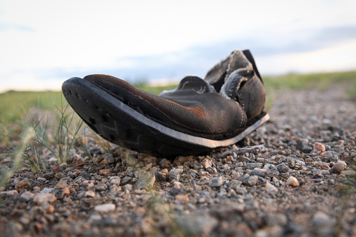 Close-up of old broken shoe, Gobi Gurvansaikhan National Park, Mongolia.