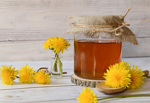 Dandelion jam in a glass jar. The concept of health. Life without cholesterol.