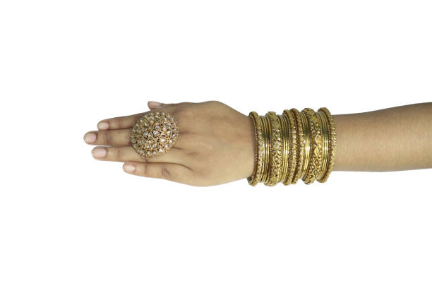 istock Beautiful golden color's bangles in the hand 1466695032
