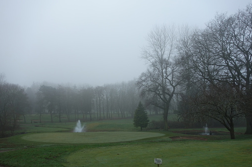 Gold course on a foggy mnorning