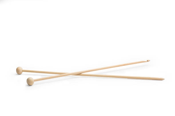 istock Wooden knitting needles isolated on a white background 1466698330