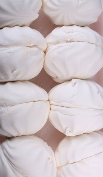 istock many white marshmallow on pink background at dry day 1466698636