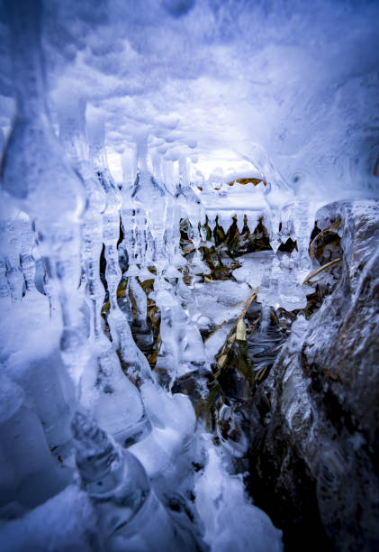 Stolactid icicles under ice stock photo