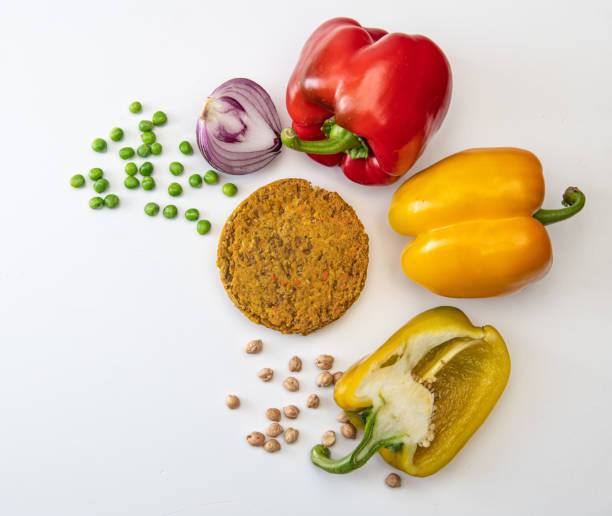 Vegan burger ingredients Vegan burger ingredients isolated on a  table (bell pepper and peas) meat substitute stock pictures, royalty-free photos & images