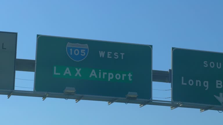 Car POV on Los Angeles airport road sign on the highway in 4k slow motion 60fps