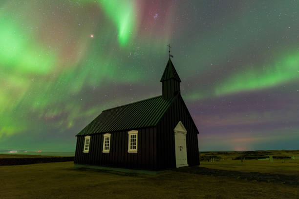 istock Budir black church under northern lights (aurora borealis), Iceland 1466702687