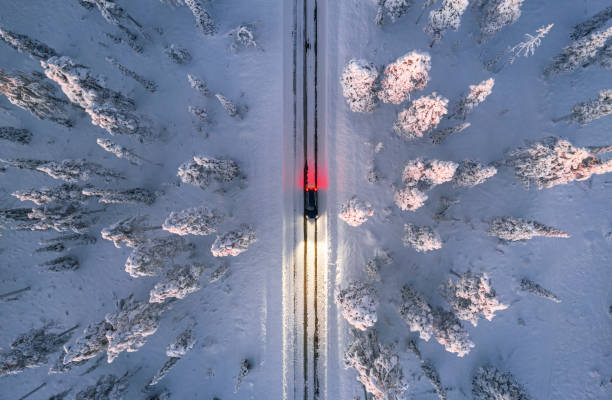 istock Car on winter road, aerial view 1466703441