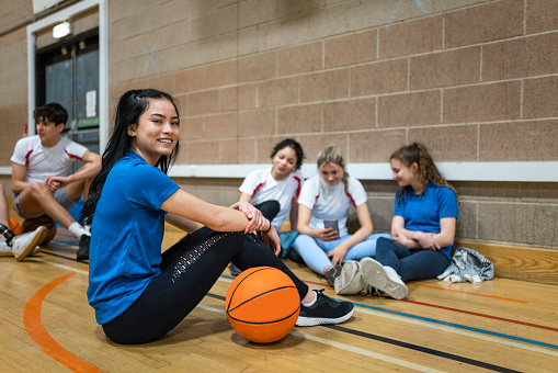 Youth Basketball Players in a Team on Training Drill. Young Boys Practice Basketball With Young Coach. Basketball Training Unit For Youth Players