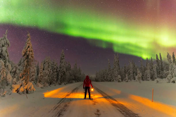 istock Touris with light under the sky with northern lights 1466704124