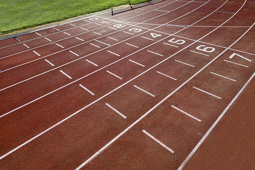 A shot of an atheltics running track with no people in the frame.