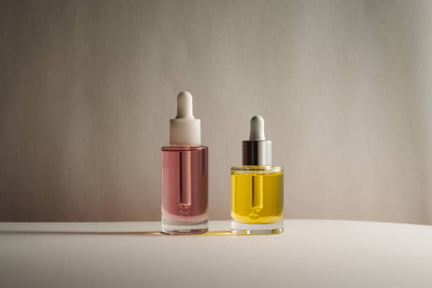 istock pink and yellow face and hair oils 1466706052