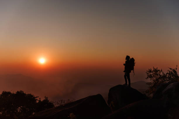 istock Silhouette adventure Man on the peak 1466711592