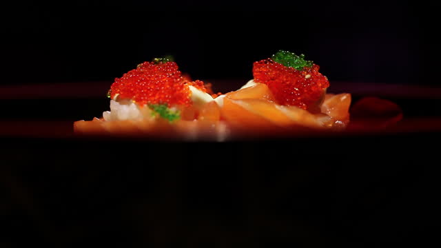 Japanese sushi presentation on dark background