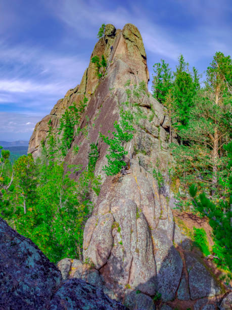 istock High rocks surrounded by coniferous forests for advanced hiking and alpinism. High resolution photo. 1466717229