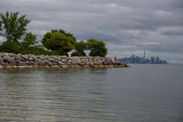 Photo of A view of Lake Ontario from a cottage. Peaceful summer sky and blue water.